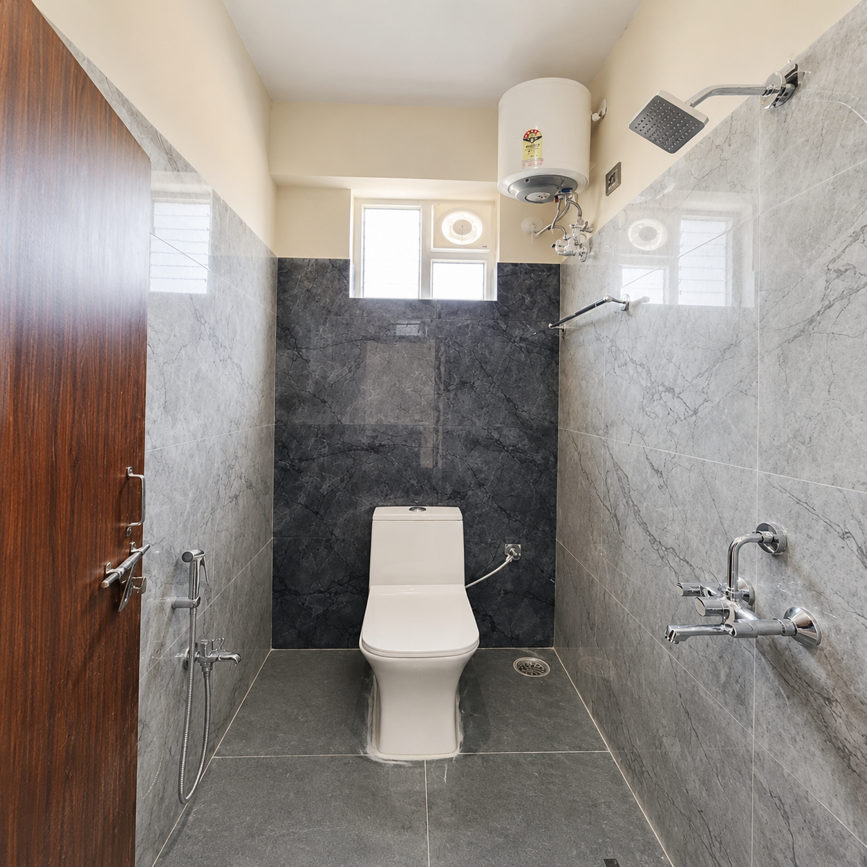 modern bathroom design, contemporary bathroom interior, minimalist bathroom, compact bathroom ideas, small bathroom design, bathroom renovation ideas, stylish bathroom interior, elegant bathroom decor, luxury bathroom inspiration, functional bathroom layout, practical bathroom design, clean bathroom aesthetic, marble tile bathroom, gray marble bathroom, stone tile bathroom, glossy wall tiles, dark floor tiles, modern toilet design, wall mounted water heater, bathroom shower design, rainfall shower head, chrome bathroom fixtures, bathroom faucet design, handheld bidet spray, bathroom ventilation window, natural light bathroom, space efficient bathroom, apartment bathroom design, home bathroom ideas, affordable bathroom makeover, budget bathroom renovation, easy maintenance bathroom, student bathroom ideas, student accommodation bathroom, bathroom for students, working professional home, bathroom for working professionals, bachelor home bathroom, young professional apartment, family bathroom design, modern home interiors, neutral bathroom decor, monochrome bathroom design, premium bathroom fittings, smart bathroom layout, hygienic bathroom design, newly built bathroom, first home bathroom, rental bathroom ideas, real estate interior photography.